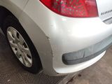 a close up of a car ' s tail light and bumper