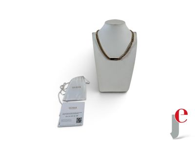a necklace on a mannequin with a price tag next to it