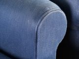 two blue chairs that are next to each other