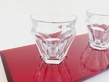 two glasses that are sitting on a red tray