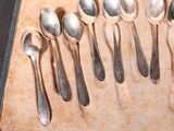 several spoons and spoon spoons are lined up on a table