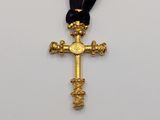 gold cross with a black cord and a gold cross with a black cord and a gold cross with a black cord and a gold cross with a black cord and a
