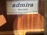 a sign that says admira on the door of a building