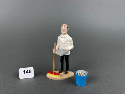 a figurine of a man with a broom and a bucket