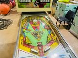 a pinball machine that is on display in a room