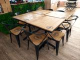 a table with six chairs around it in a room