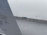 a close up of a car door with a sticker on it