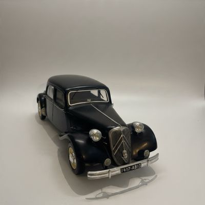a toy car that is sitting on a white surface
