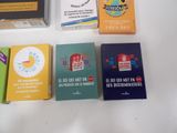 a lot of books that are sitting on top of a table