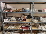 many shelves with various items on them in a room