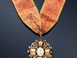 a close up of a medal with a ribbon around it