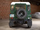an image of a green land rover parked in a garage