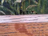 a picture of a painting of a bird on a wooden table
