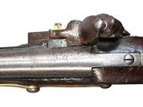 an old gun with a dog on the side of it