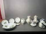 many different types of pottery on the table