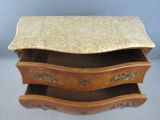 a marble top desk with three drawers and a marble top top