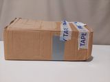 a cardboard box with tape on it sitting on a table