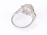 an image of a close up of a diamond ring on a white surface