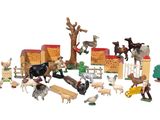 a lot of toy animals that are on a white surface