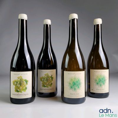 three bottles of wine sitting next to each other on a table