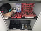 many tools on a shelf in a room