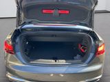 the back of a car with its trunk open and the back of the car with its trunk open