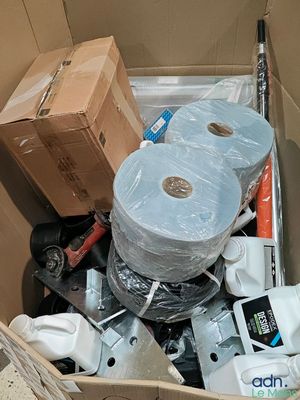 a cardboard box filled with toilet paper and toilet paper rolls