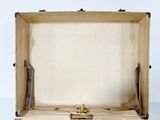 an open suitcase sitting on a white surface