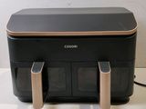 a black and gold printer sitting on a white table