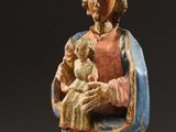 an image of a statue of a woman holding a baby