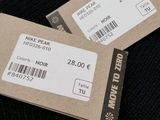two tickets on the back of a pair of black socks