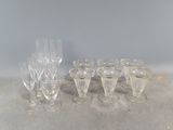 a lot of wine glasses sitting on a table