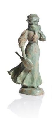 a statue of a woman with a hat and a cane