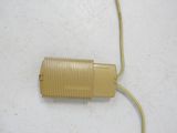 a yellow cord connected to an electrical device on a white surface