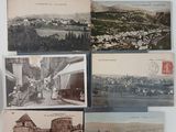 many old postcards hanging on the wall of this room