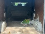 the back of a van with the door open and the back of the van with the back door open