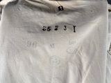 a close up of a person ' s shirt on a mannequin mannequin