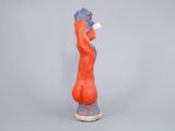 statue of a woman holding a baseball bat in her right hand