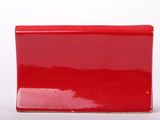 a red box that is sitting on a white surface