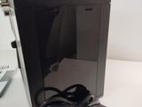 an image of a computer with a power cord plugged into it