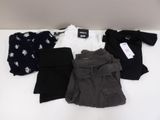 several pieces of clothing are laid out on a white surface