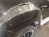 a close up of a car with a denting on the side of it