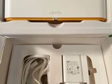 a white box with a charger and a charger in it