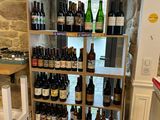 a wine rack in the corner of a kitchen filled with bottles of wine