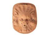 une image représentant une sculpture en argile représentant une tête de lion