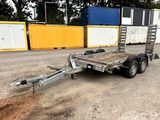 a trailer that is parked in the dirt