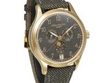 an image of a gold wrist watch with a black dial