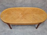 a wooden table with a herringle pattern on the top