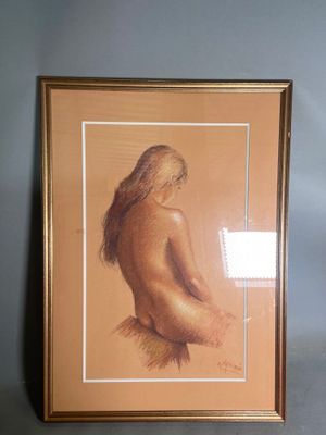 painting of a nude woman in a gold frame on a blue wall