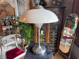 a lamp that is sitting on a table in a room